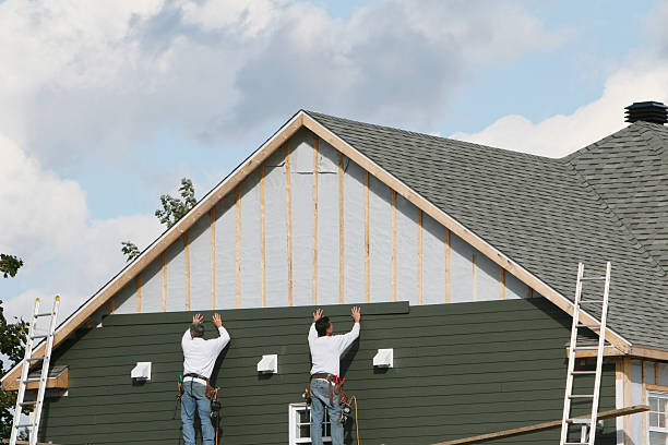 Professional Storm Damage Siding Repair technician working in White Plains, NC